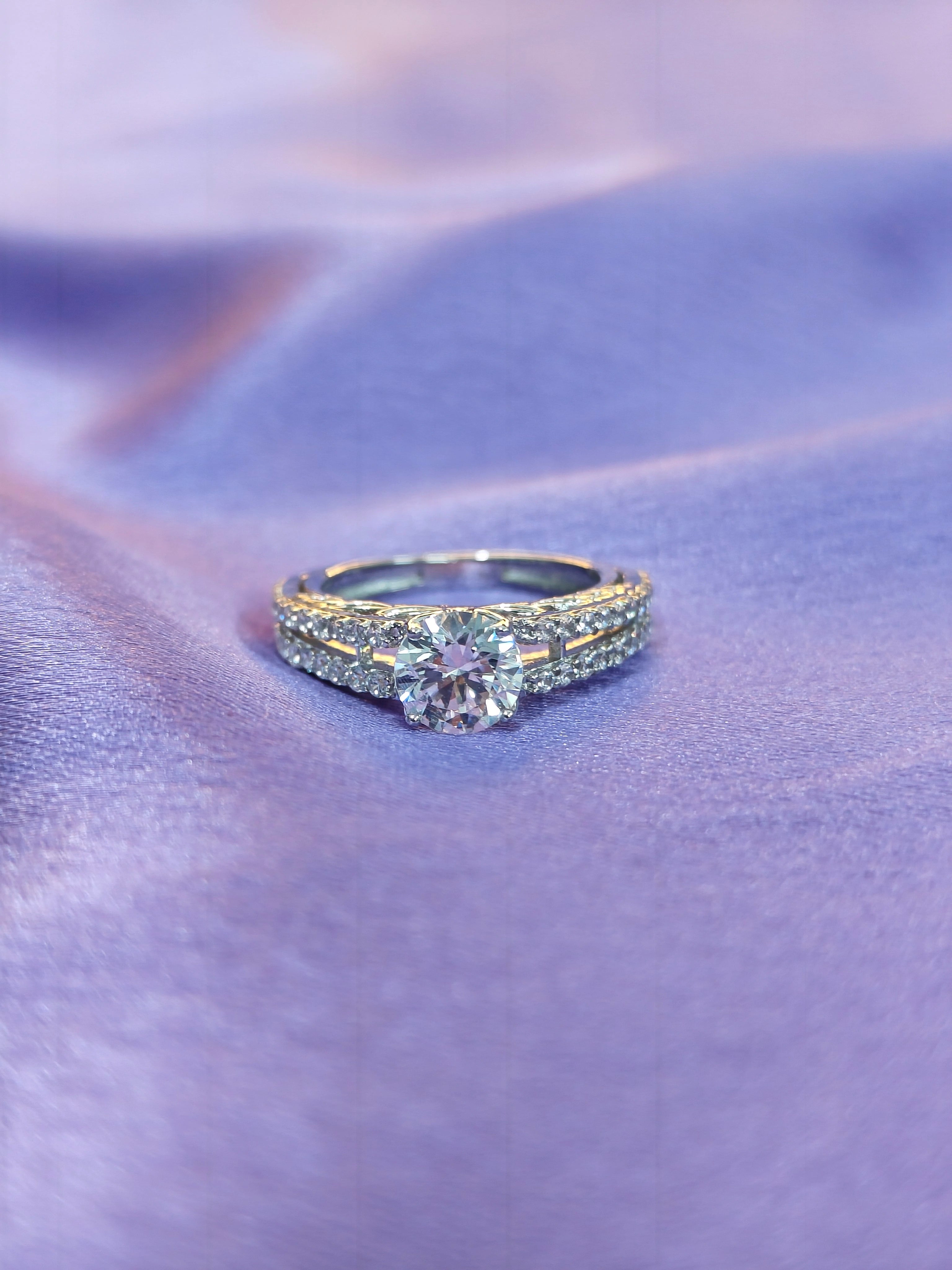 Diamond ring on a purple fabric background